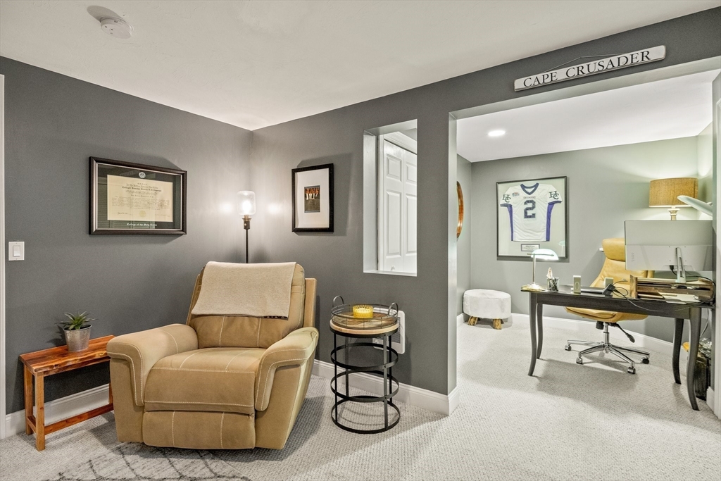 26 West Way Mashpee, MA 02649 - Photo 33 of 42 a living room with furniture a rug and a desk