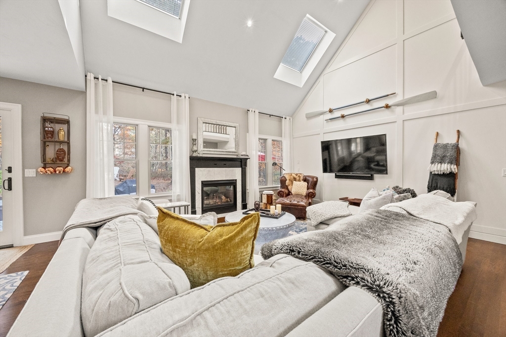 26 West Way Mashpee, MA 02649 - Photo 8 of 42 a living room with furniture fireplace and flat screen tv