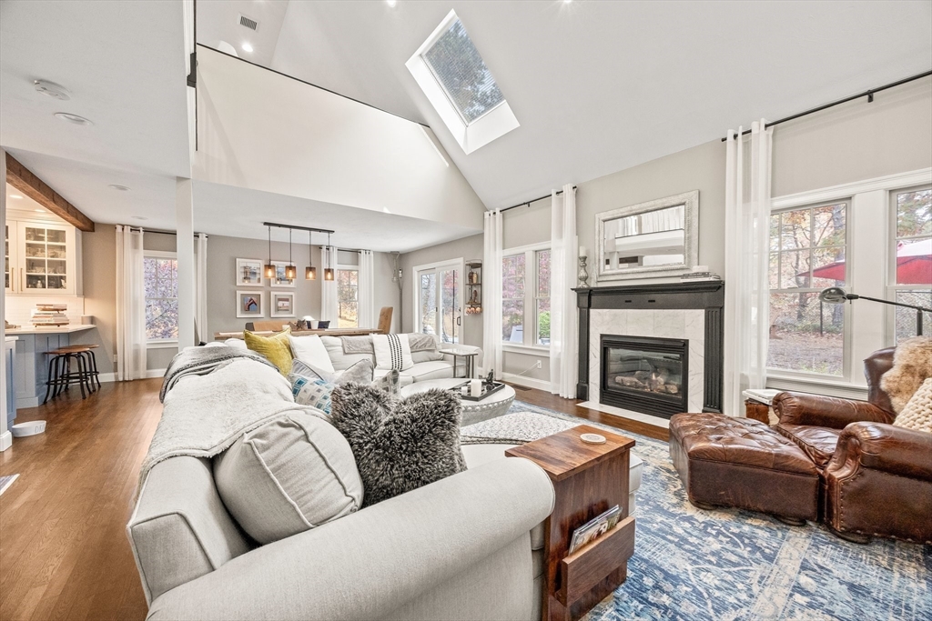 26 West Way Mashpee, MA 02649 - Photo 9 of 42 a living room with furniture fireplace and a window