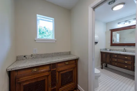 a room with a stove and a sink