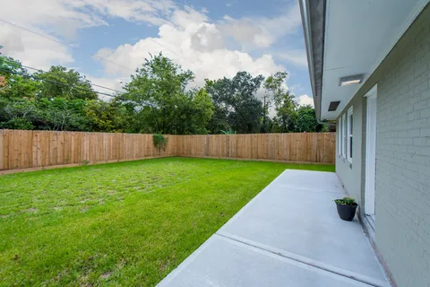 a view of backyard with green space