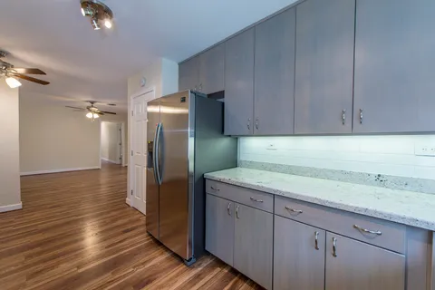 a kitchen with a sink and refrigerator