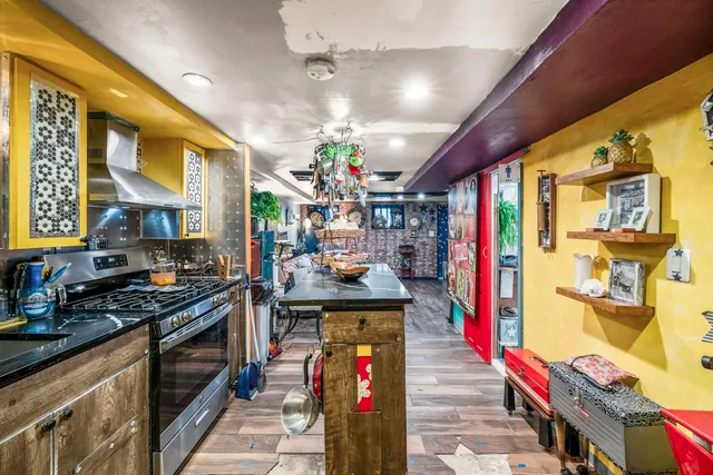 a bathroom with a toilet and shower curtain