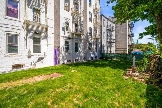 a view of a building with a yard