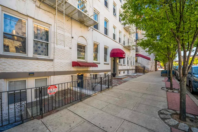 a view of a patio with a table and chairs