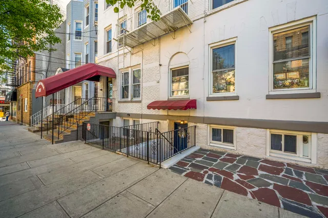 a living room filled with lots of furniture and clutter