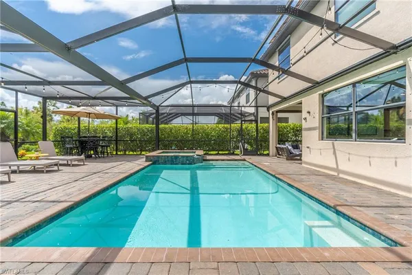 a view of a backyard with a swimming pool