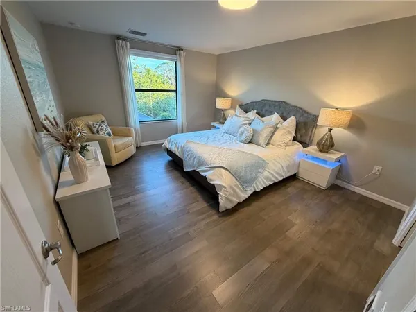 a bedroom with a bed and a couch