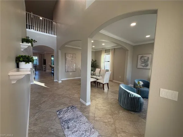 a living room with furniture and a rug