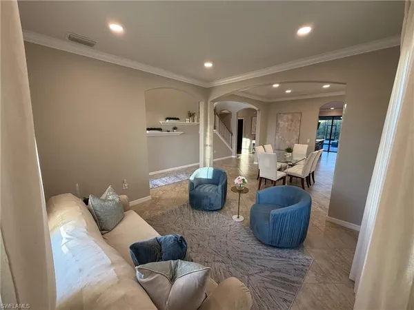 a living room with furniture and a window