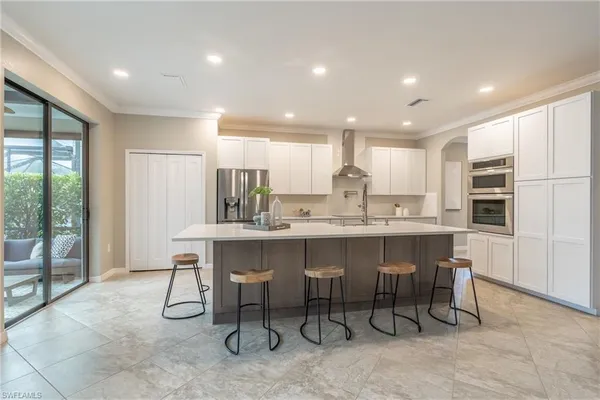 a kitchen with kitchen island granite countertop wooden cabinets and counter top space