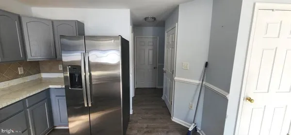 a utility room with washing machine