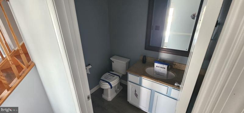 351 Thumper Drive Ranson, WV 25438 - Photo 17 of 44 a bathroom with a granite countertop sink and a mirror