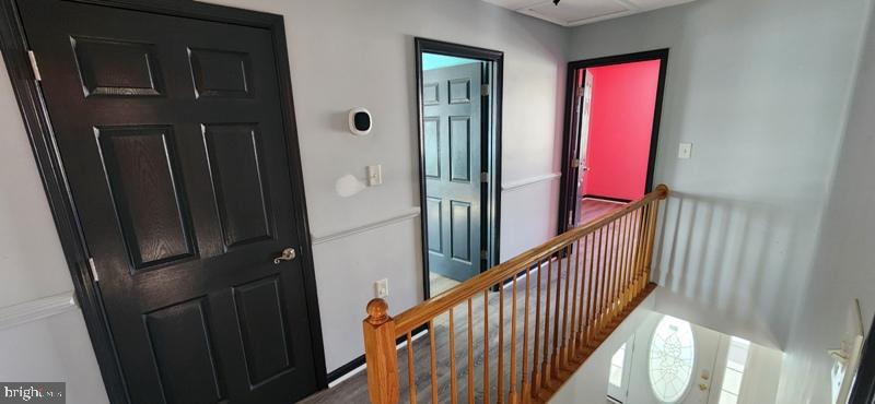 351 Thumper Drive Ranson, WV 25438 - Photo 20 of 44 a view of a hallway with wooden floor and stairs