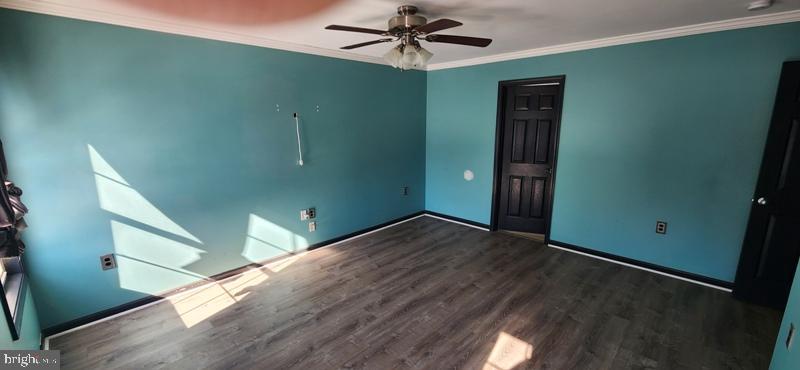 351 Thumper Drive Ranson, WV 25438 - Photo 22 of 44 a view of a livingroom with a ceiling fan and hardwood floor