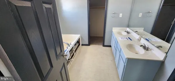 a utility room with a sink washer and dryer