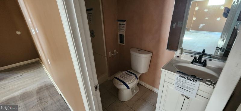 351 Thumper Drive Ranson, WV 25438 - Photo 30 of 44 a bathroom with a sink a toilet and a mirror