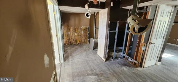 a view of entryway with wooden floor and stairs