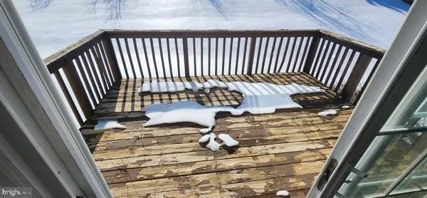 a view of a balcony with wooden floor