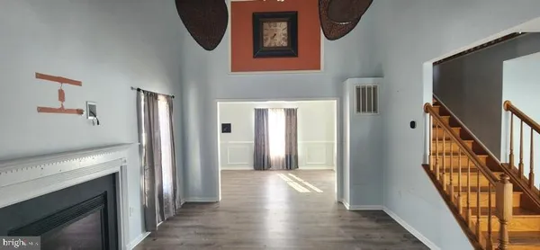 a view of an entryway with wooden floor