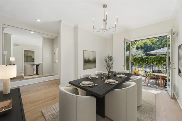 a kitchen with a sink and living room view