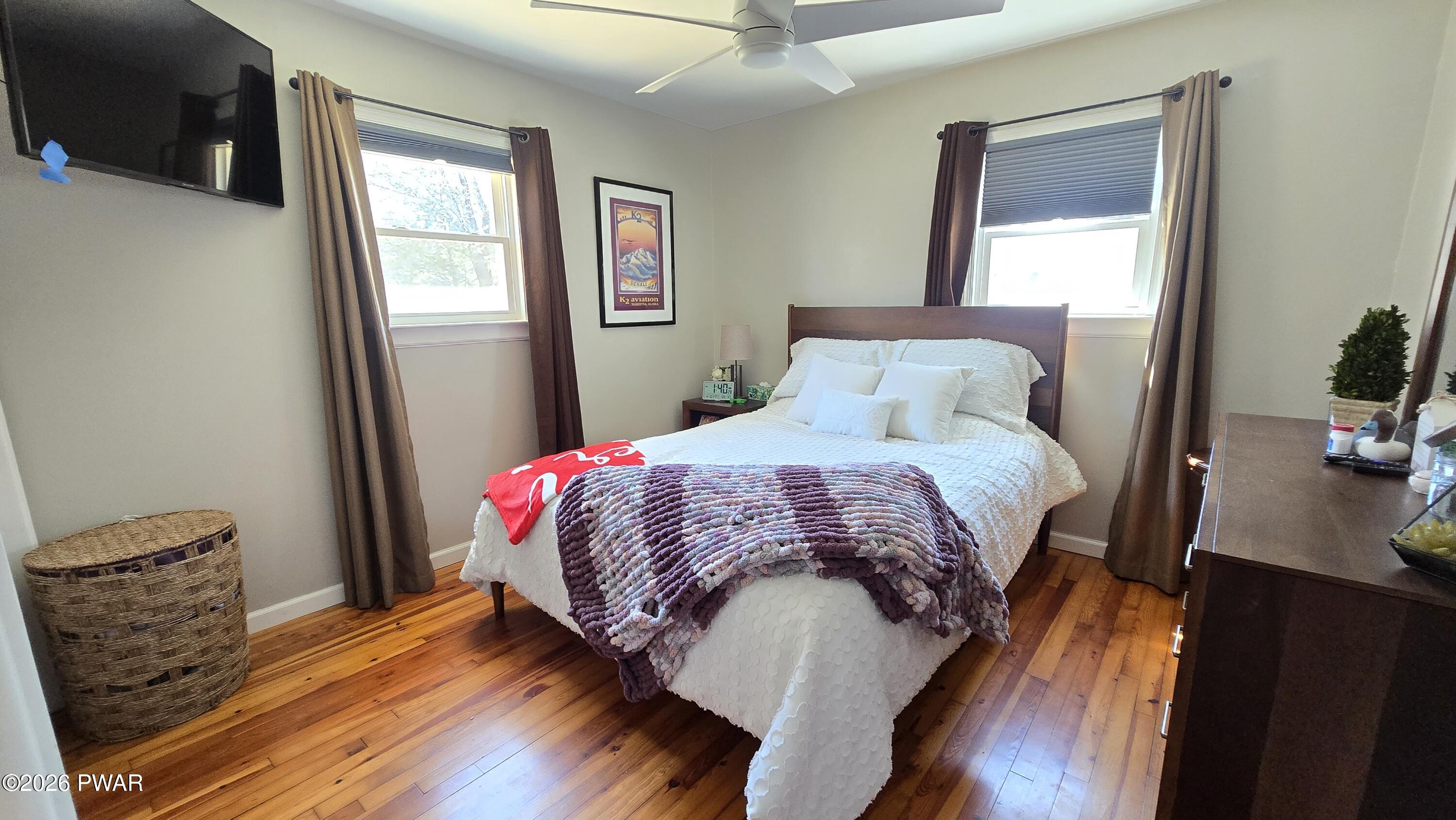 430 Griffith Road Tyler Hill, PA 18469 - Photo 11 of 31 a bedroom with a bed and wooden floor