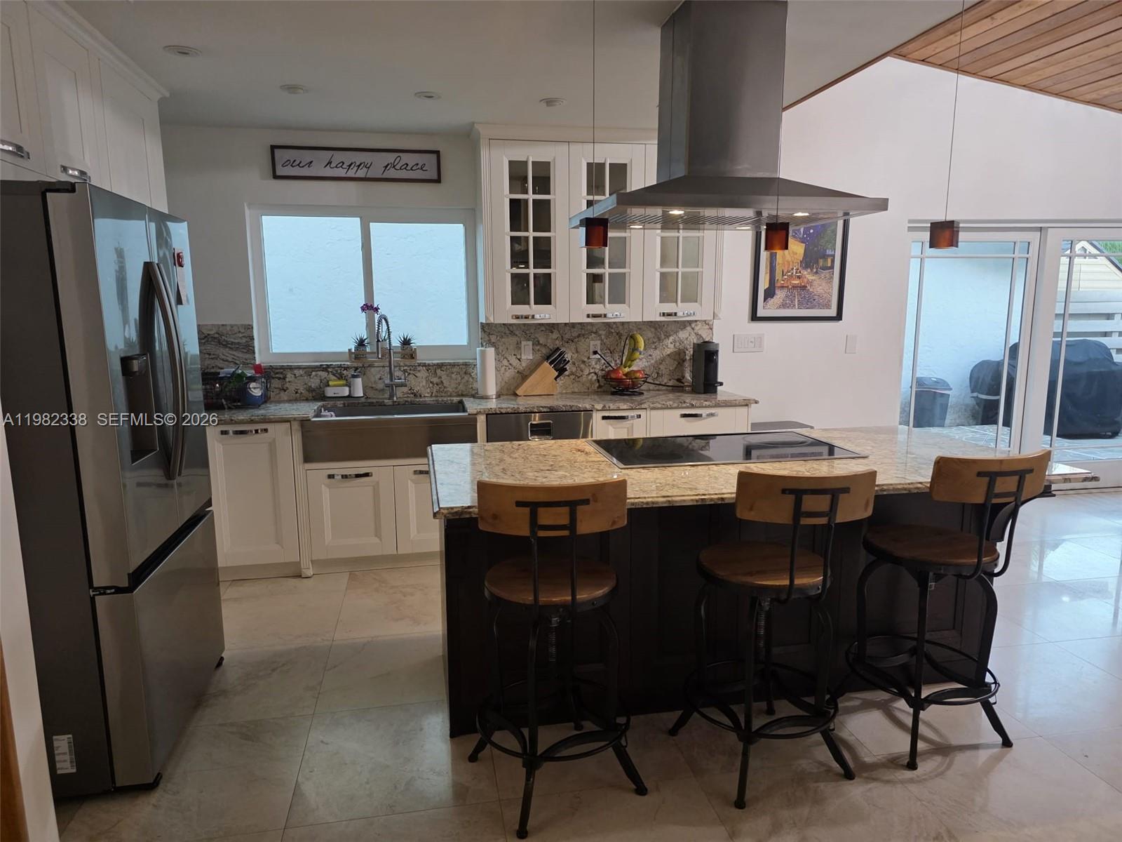 14530 Southwest 110th Street Miami, FL 33186 - Photo 13 of 45 a kitchen with a sink stove and refrigerator