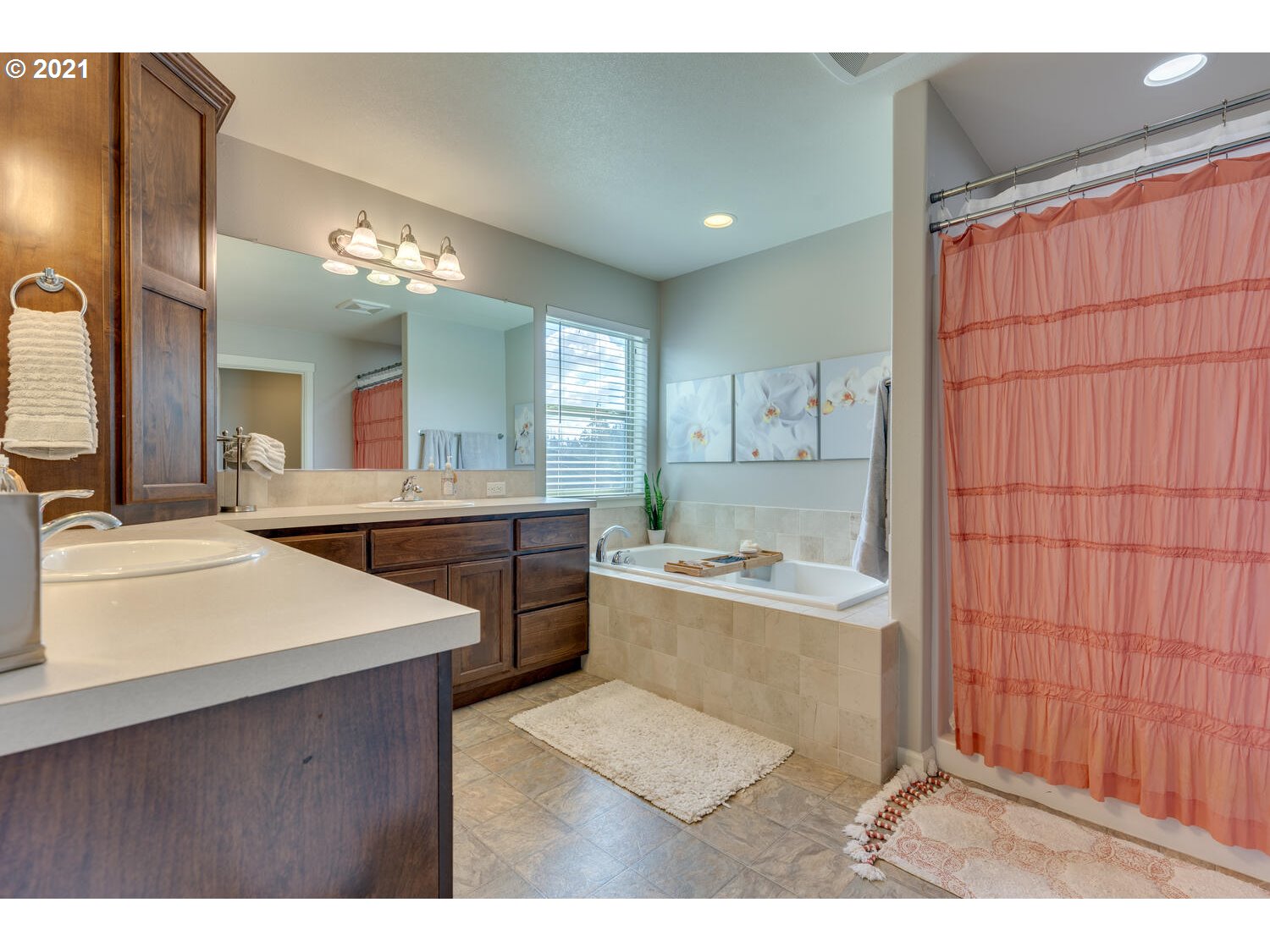 2314 South Wind River Way Ridgefield, WA 98642 - Photo 13 of 19 a bathroom with a sink vanity granite tub and a mirror