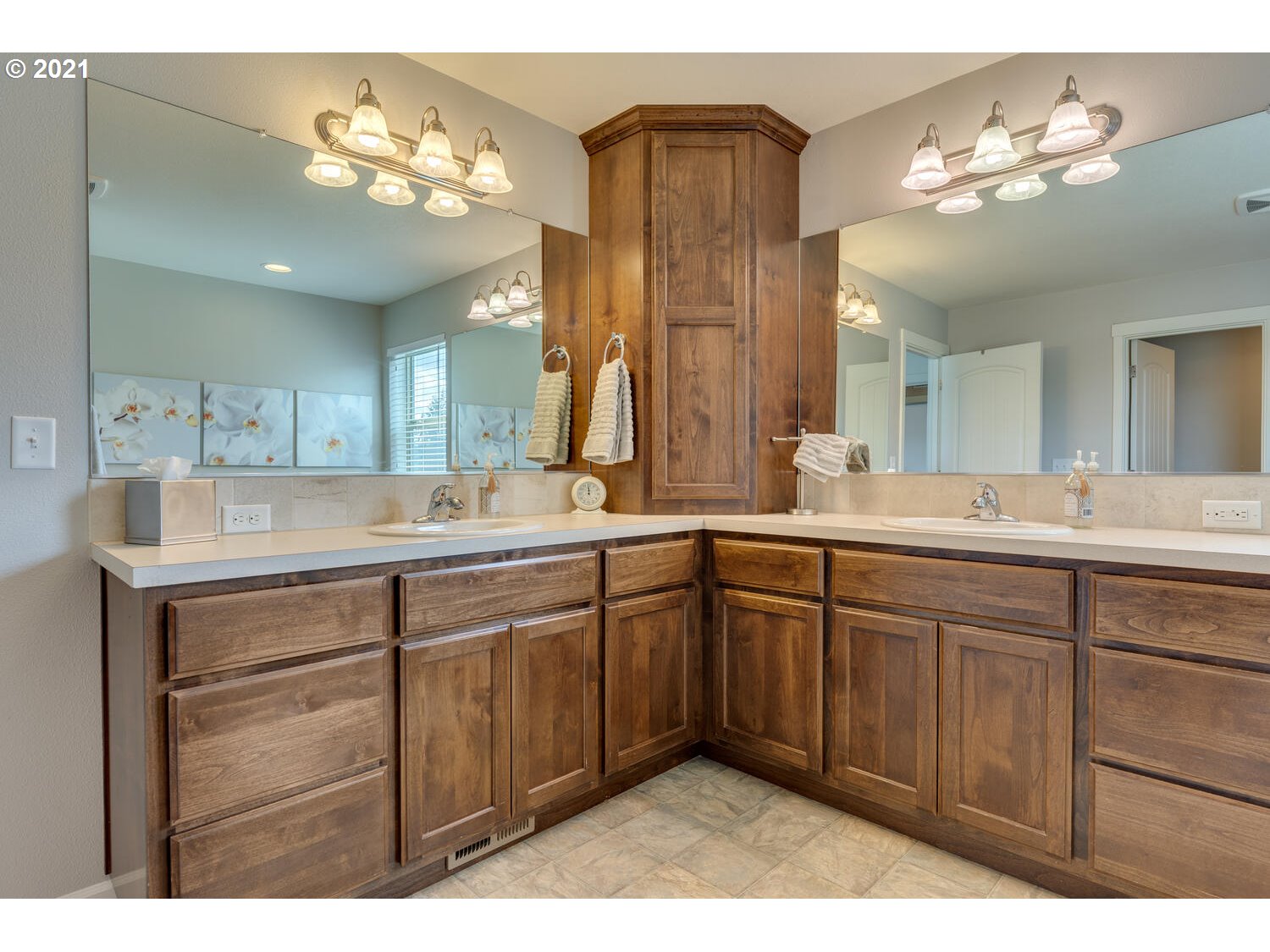 2314 South Wind River Way Ridgefield, WA 98642 - Photo 14 of 19 a spacious bathroom with a double vanity sink and a mirror