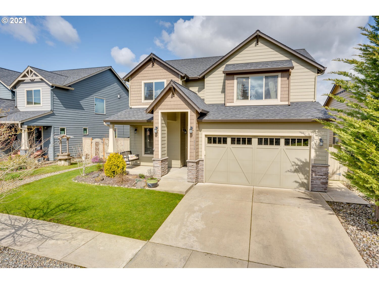 2314 South Wind River Way Ridgefield, WA 98642 - Photo 19 of 19 a front view of a house with a yard and porch