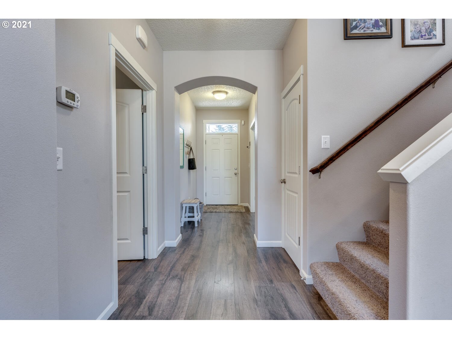 2314 South Wind River Way Ridgefield, WA 98642 - Photo 2 of 19 a view of a hallway with wooden floor