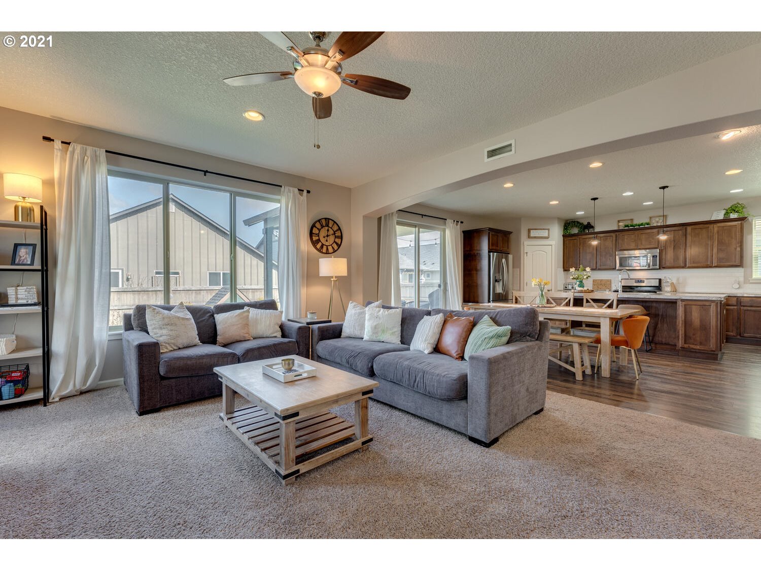 2314 South Wind River Way Ridgefield, WA 98642 - Photo 5 of 19 a living room with furniture kitchen view and a large window