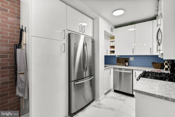 a kitchen with sink and cabinets