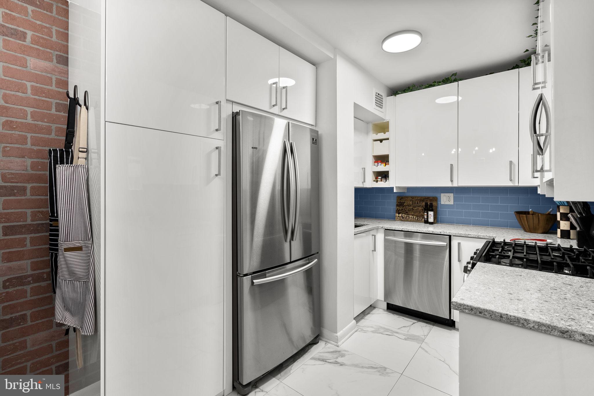 3900 Tunlaw Road Northwest, Unit 101 Washington, DC 20007 - Photo 13 of 28 Stainless Steel appliances. Built-in pantry
