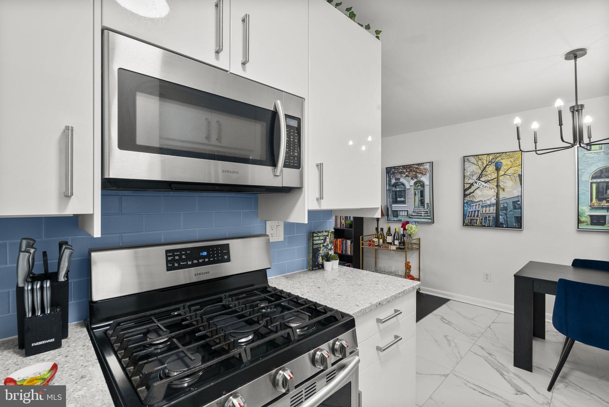 3900 Tunlaw Road Northwest, Unit 101 Washington, DC 20007 - Photo 15 of 28 5 burner gas stove and microwave