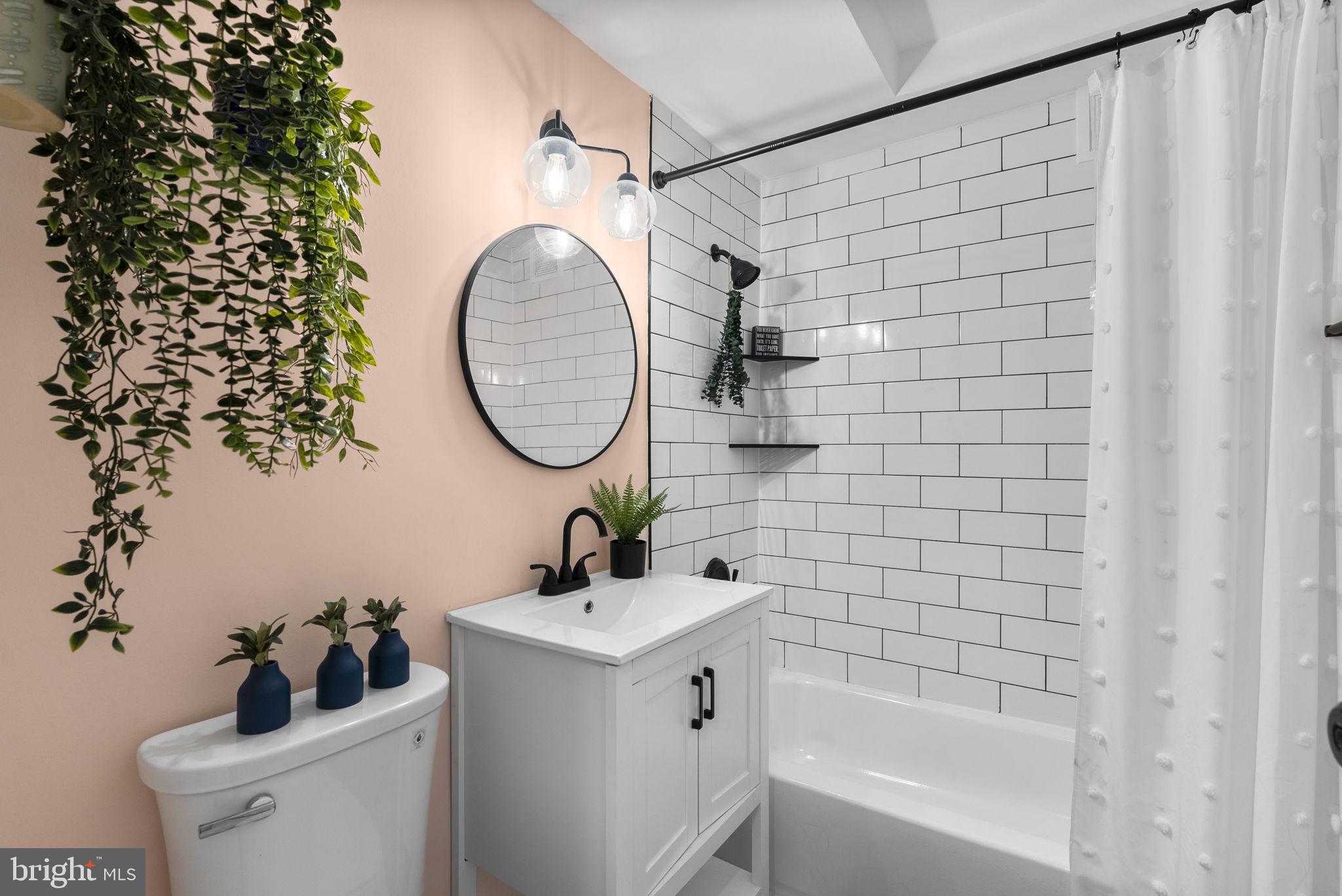 3900 Tunlaw Road Northwest, Unit 101 Washington, DC 20007 - Photo 21 of 28 Remodeled bathroom with subway tile