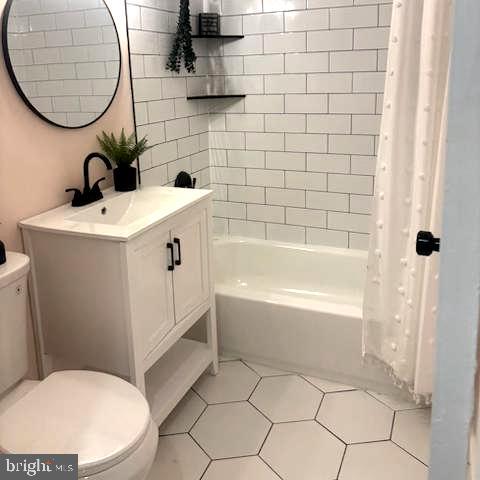 3900 Tunlaw Road Northwest, Unit 101 Washington, DC 20007 - Photo 22 of 28 Beautiful vanity and tile flooring