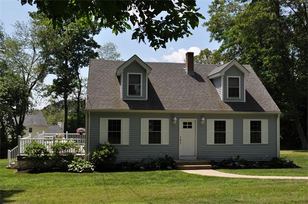 a front view of a house with a yard