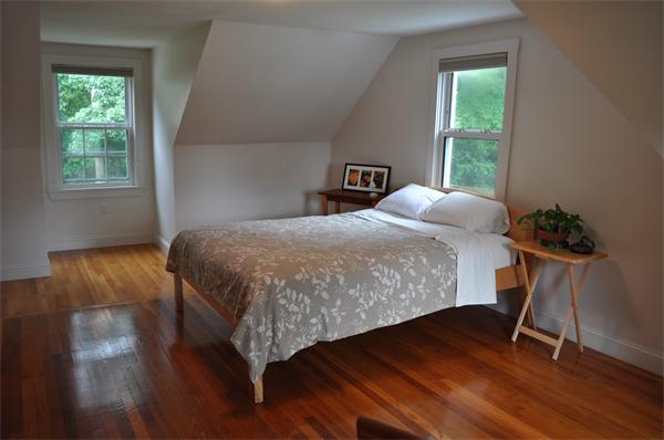 20 Frankland Road Ashland, MA 01721 - Photo 14 of 22 a bedroom with a bed and a potted plant