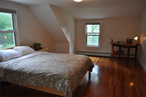 20 Frankland Road Ashland, MA 01721 - Photo 15 of 22 a bedroom with a bed and wooden floor