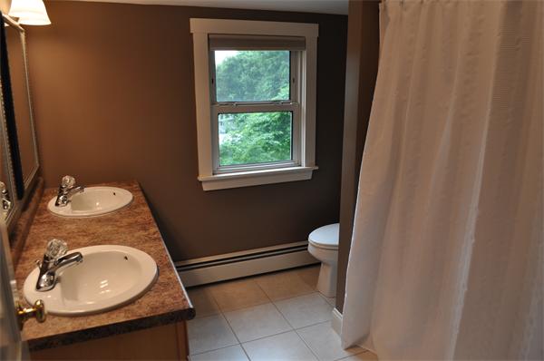 20 Frankland Road Ashland, MA 01721 - Photo 16 of 22 a bathroom with a granite countertop sink and a mirror