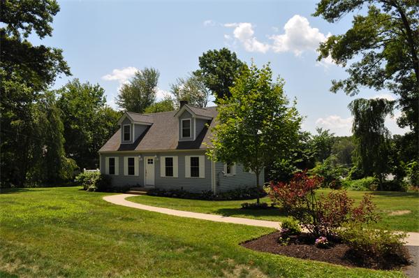 20 Frankland Road Ashland, MA 01721 - Photo 2 of 22 a front view of a house with garden