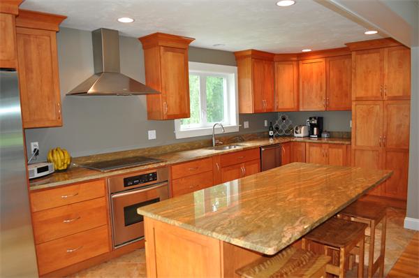 20 Frankland Road Ashland, MA 01721 - Photo 3 of 22 a kitchen with stainless steel appliances granite countertop a sink stove and cabinets