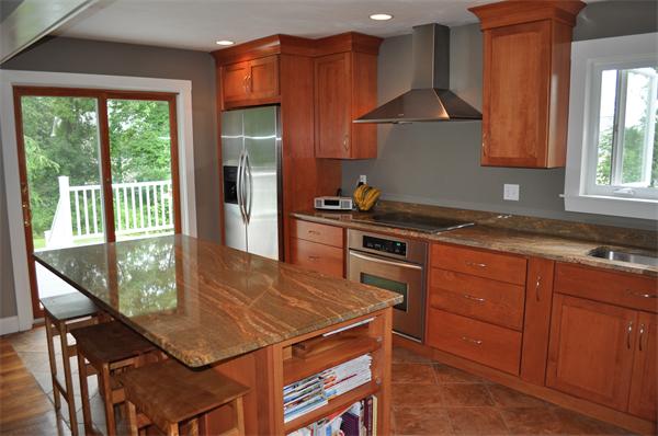 20 Frankland Road Ashland, MA 01721 - Photo 4 of 22 a kitchen with a stove a sink and a wooden cabinets