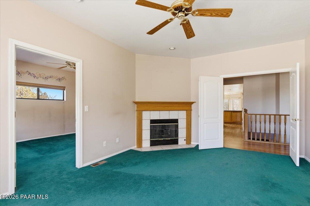 2101 Meander Prescott, AZ 86305 - Photo 12 of 22 a view of an empty room with a fireplace and a window