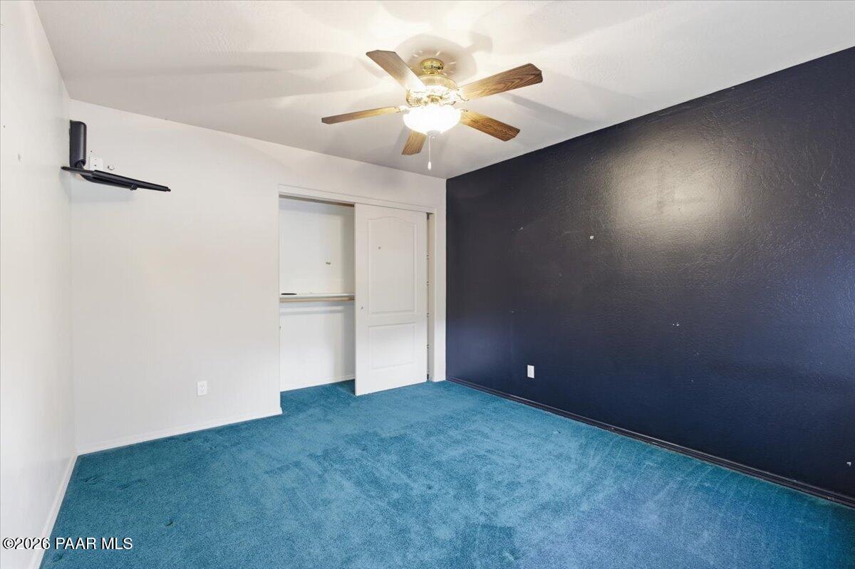 2101 Meander Prescott, AZ 86305 - Photo 17 of 22 a view of an empty room with a ceiling fan