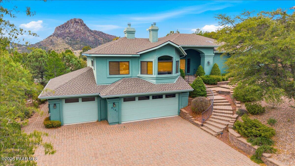 2101 Meander Prescott, AZ 86305 - Photo 2 of 9 a front view of a house with a garden