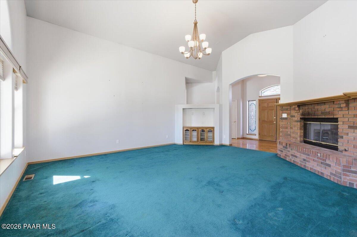 2101 Meander Prescott, AZ 86305 - Photo 4 of 22 a view of empty room with fireplace and fan
