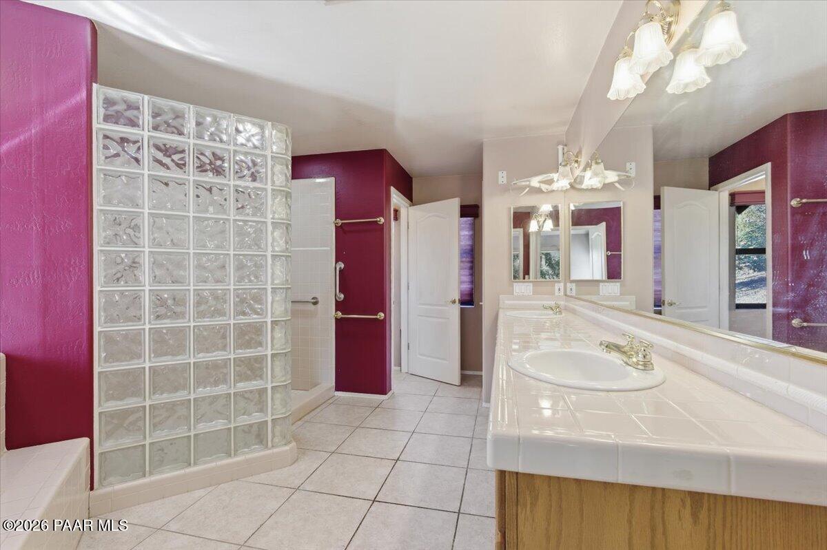 2101 Meander Prescott, AZ 86305 - Photo 9 of 22 a bathroom with a tub a sink and a mirror