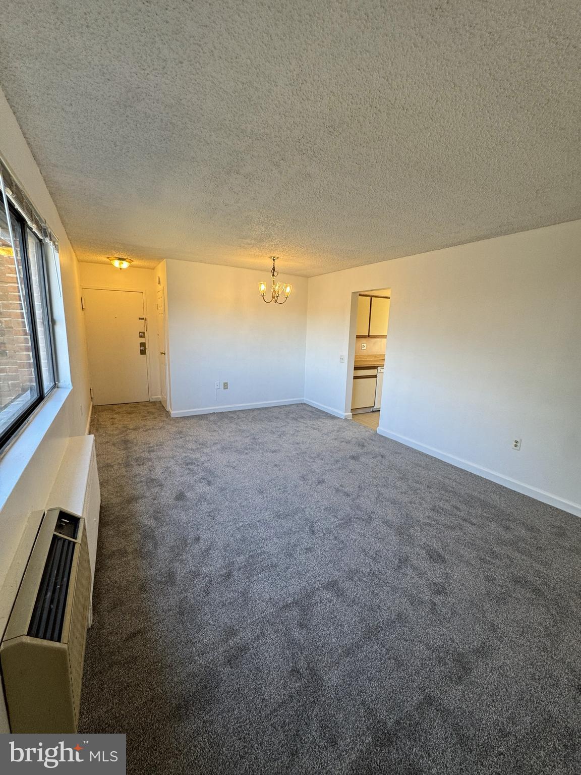 4717 1st Street Southwest, Unit 303 Washington, DC 20032 - Photo 4 of 8 a view of an empty room with a window